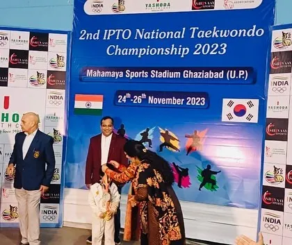 A young student being awarded for his success at the national level. It is a testament to his focus and the supportive environment of our dojang.