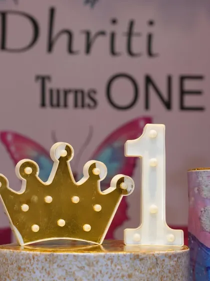 A detail shot of the light-up crown and number "1" for a first birthday party. These props look great in photos.