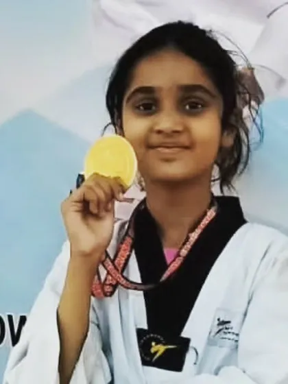 This little champ is thrilled with her gold medal from the Warriors Championship. We love seeing our students shine.