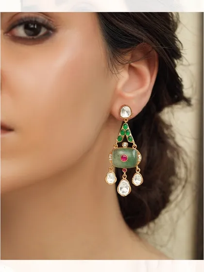 Delicate drop earrings featuring a unique combination of emeralds and polki, perfect for a subtle yet stylish statement.