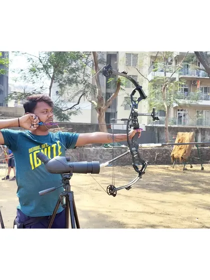 A close-up shot of an archer at full draw. You can see the alignment of the eye, the sight, and the target, the three key components for an accurate shot.