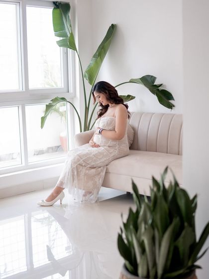 A full-length view of a maternity session in my studio, showing how we use the space and natural light.