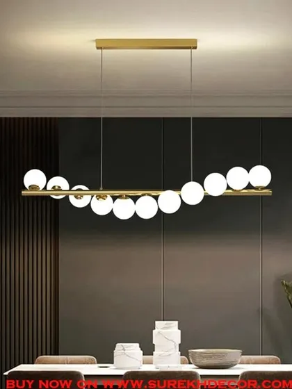 A beautiful view of our 11-ball chandelier, showcasing its elegant design and warm illumination. The golden finish and white glass spheres create a modern yet timeless look that enhances any dining or living space.