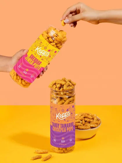 This shot tells a story of sharing and enjoyment. The two-toned background adds visual interest, while the action of pouring and taking a puff makes the product feel interactive and perfect for social settings.