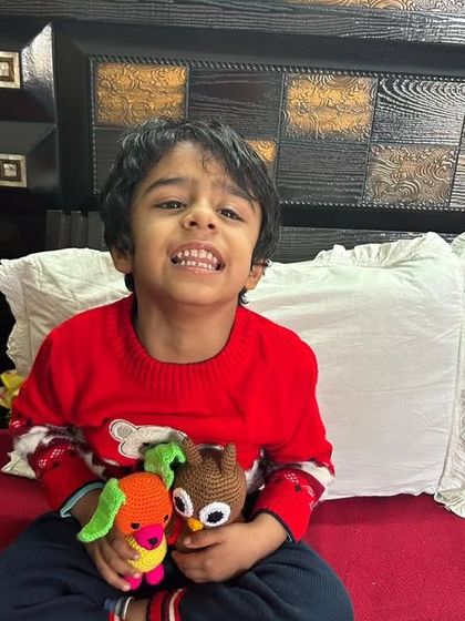 A happy little customer with his new owl and dog toys. Seeing these smiles is my greatest reward.