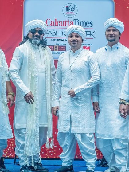 The brotherhood in all white. A group photo from the Calcutta Times Fashion Week, where our look was as curated as our music.