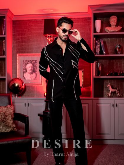 Another view of the zipper-detailed shirt, showcasing its sharp tailoring and the confident attitude it inspires.