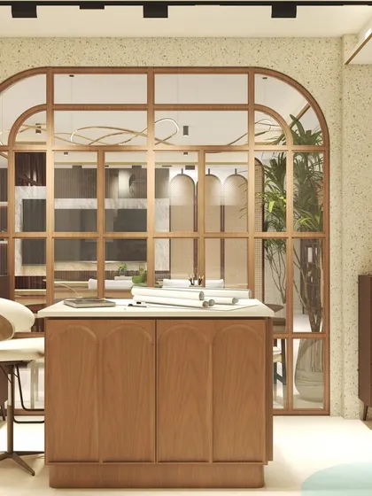 This private cabin was designed for a client who wanted a bright, warm, and inspiring workspace. I used a large, wood-framed arched glass partition to maintain an open feel while ensuring privacy. The custom desk with a marble top and ergonomic chair create a comfortable and stylish workstation.
