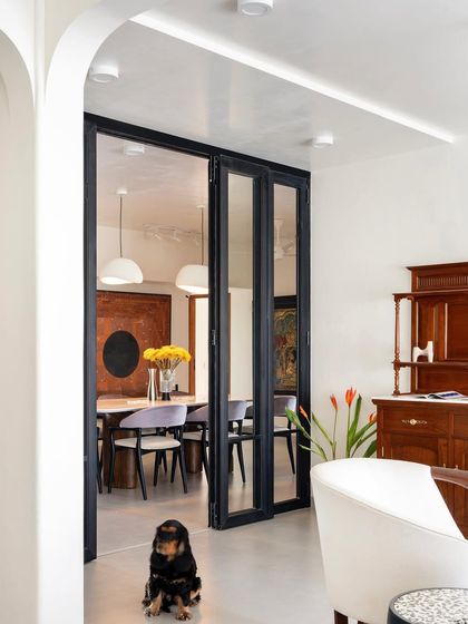 Spread across 2000 square feet, this 4BHK apartment has an overarching sense of fluidity that permeates the apartment. It was important for our clients to have a generous living and dining area with an open kitchen set up that would work well to host their friends and families. Our idea was to create a well-balanced and harmonious space and our designs reflect the clients’ personalities, so each is unique. We started by playing with material palettes and finding areas that we wanted to sculpt, like the walls, entryways to rooms/passages and furniture pieces. This inspired us to weave a common language of textures, materials and aesthetically happy colour blocking. We added colours through furniture pieces,upholstery, artwork and balanced it out with white rendered ceilings, walls and grey floors.