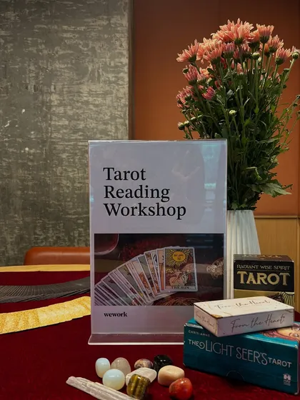 A closer look at my setup for the WeWork Tarot Reading Workshop. You can see the informational sign, my collection of crystals, and several of the decks I use to teach and read with.