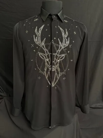 A black designer shirt featuring the geometric stag motif embroidered in shimmering silver thread. This piece combines mythological themes with a modern, edgy aesthetic.
