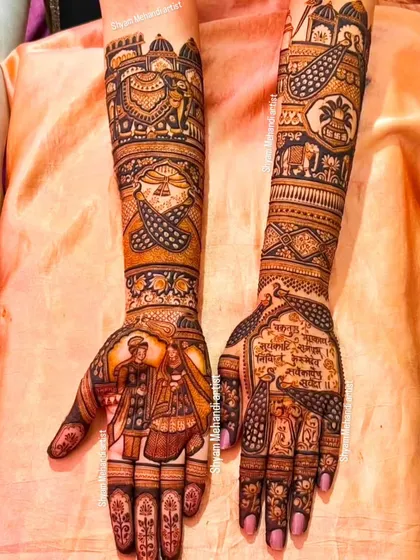 A complex design featuring a mix of portraits, mantras, and traditional patterns.
