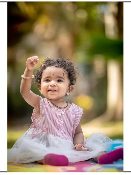A triumphant and happy gesture captured on camera. These energetic moments are what make toddler photography so much fun.