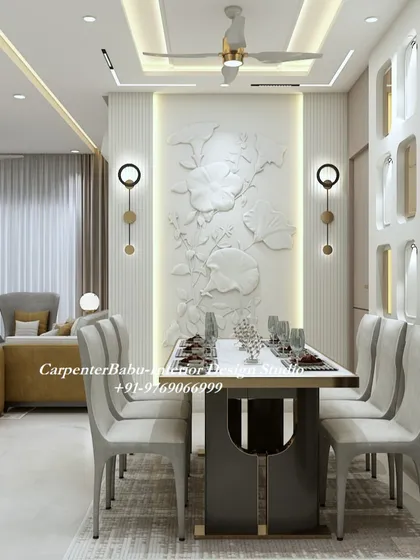 This dining area features a statement wall with a 3D floral bas-relief sculpture, beautifully illuminated to create a dramatic effect. It turns the simple act of dining into a luxurious experience.