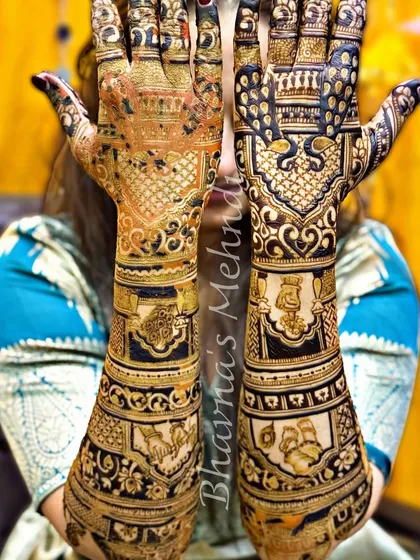 Both hands together, showing the complete Krishna-themed bridal design. The symmetry and storytelling are key elements of our training.