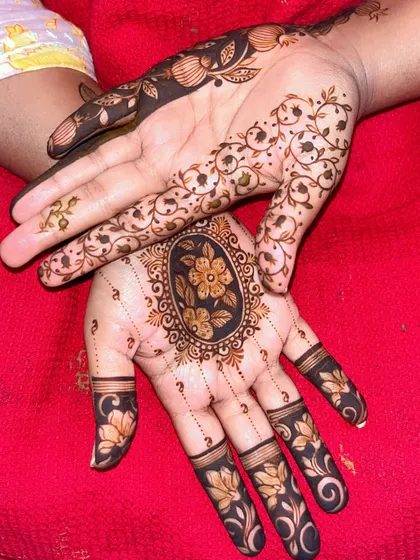 A closer look at the two distinct patterns on each hand. This showcases my ability to create varied yet complementary designs for a single bridal look.