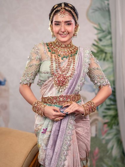 A full shot of a model in a pastel traditional saree, showcasing the complete look. This demonstrates how our studio can create a soft and elegant atmosphere for any ethnic wear.