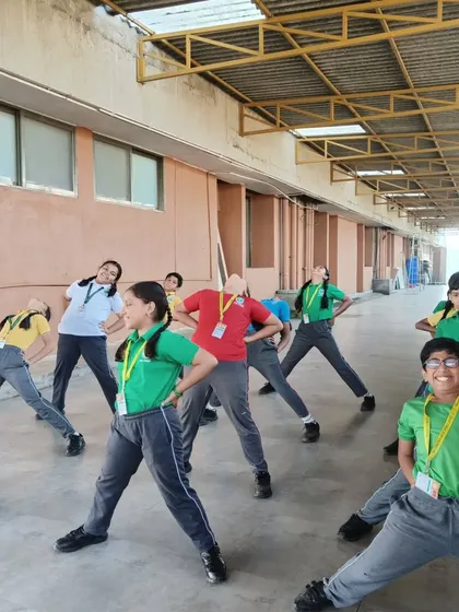Proper posture and form are taught from the very beginning. Here, students learn foundational stances and stretches that build body awareness for table tennis.