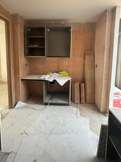 The beginnings of a kitchen or study nook, with plywood cabinetry waiting for its final finishes. This behind-the-scenes view shows the craftsmanship and construction that underpins our polished final designs.