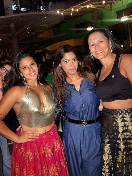 Posing with friends and fellow music lovers. These nights are all about bringing people together.
