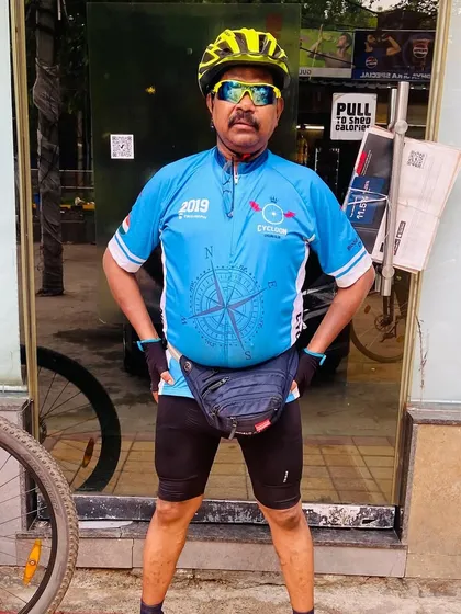 A member proudly posing with his bike. Every rider and every bike has a story in our club.