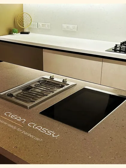 Why not have a barbecue indoors? We can integrate specialized appliances like this indoor grill right into your countertop for a clean and classy cooking experience.