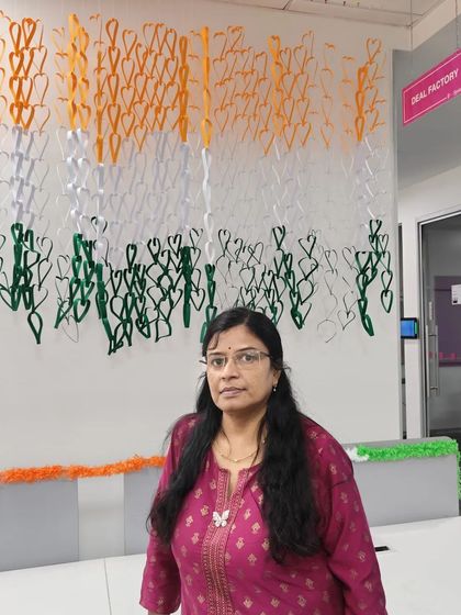 Standing proudly next to the completed paper heart flag. It was a wonderful collaborative effort.