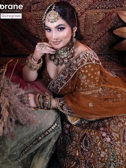 A beautiful portrait of a student's work on an Arabic bridal look. The dramatic lighting and pose create a sense of mystery and allure.