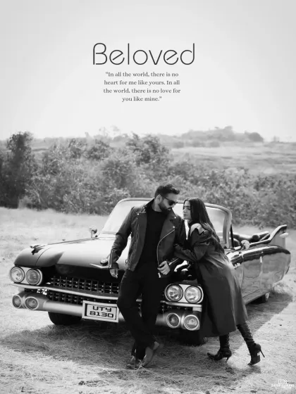 A stylish black and white photograph featuring a couple posing with a vintage convertible. This image captures a cool, retro vibe, perfect for a timeless and edgy pre-wedding album.