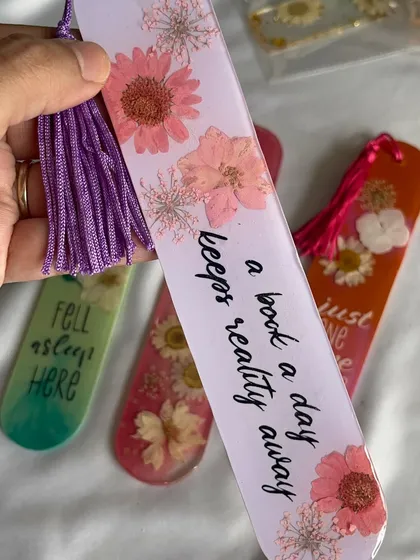"A book a day keeps reality away." Escape into your favorite stories with this beautiful floral bookmark.
