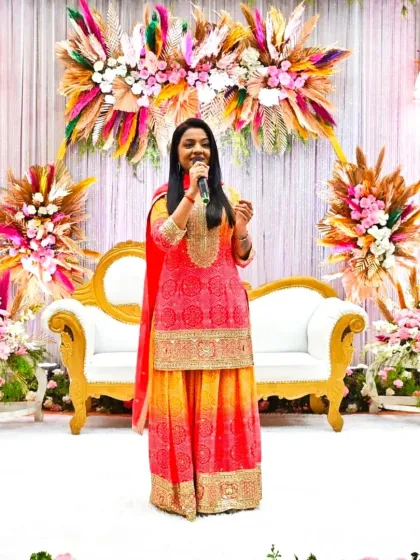 On stage, ready to host a musical engagement against a stunning floral backdrop. The right ambiance is key to creating a memorable event.