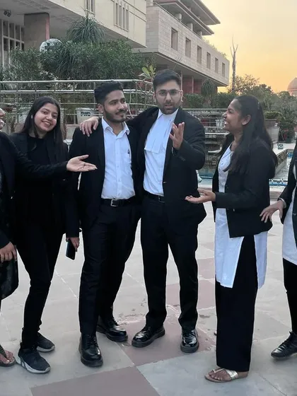 Sharing a lighter moment after a demanding day. The camaraderie in our team is what keeps us going through the pressures of legal practice.