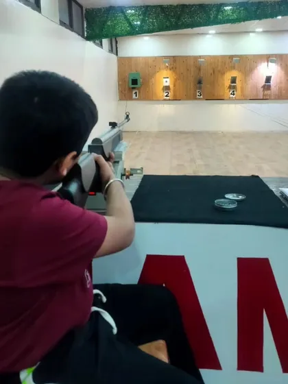 A young shooter takes aim. This sport is for everyone, regardless of age or gender. All it takes is the will to learn and the discipline to practice.