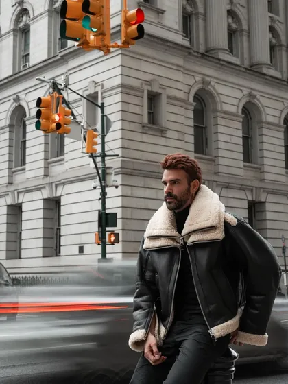 Capturing the energy of New York City using a slow shutter speed to create motion blur. This was part of a men's fashion shoot, contrasting the stillness of the subject with the city's constant movement.