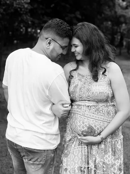 A classic black and white couple's portrait from an outdoor session. The focus is on their connection as they share a quiet moment together.