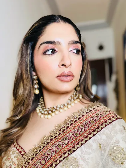 A close-up of the soft glam look, showcasing the flawless skin and the beautiful, warm tones on the eyes. It's a versatile look that's perfect for any festive occasion.