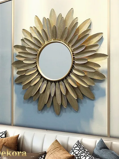 This sunburst mirror, framed by layers of golden metal leaves, adds a touch of luxury and light to any room. It's a perfect decorative mirror for a bedroom or living area, designed to make your space feel brighter and more elegant.