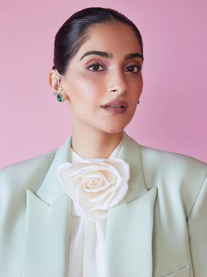A beauty shot of Sonam Kapoor, focusing on the clean makeup and the stunning Amrapali ear crawler that completed her modern pantsuit look.