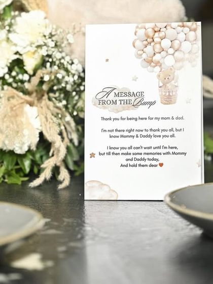 A personalized 'Message from the Bump' card placed at each table setting. This sweet note from the baby-to-be is a heartwarming detail that guests appreciate.