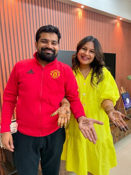 A happy photo with my dear clients and friends, showing off their couple's mehendi. It's always special to create art for people you care about.