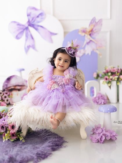A little princess on her throne. This shot from our purple fairy-themed session captures a sweet and regal portrait.