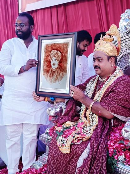 I was deeply honored to present this blood art portrait to a respected spiritual guru. This moment was even captured in a local newspaper, which was a humbling experience for me.