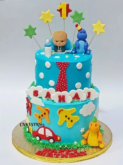 A fun two-tier cake combining the Boss Baby theme with dinosaurs and cars. This 3kg cake is perfect for a little one with many interests, celebrating their first birthday in style.