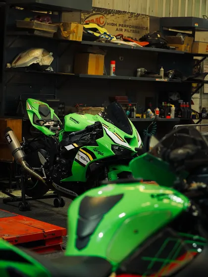 A Kawasaki ZX-10R on the lift in our workshop. We provide on-site mechanics at our track days, but the serious work happens here at Greasehouse.