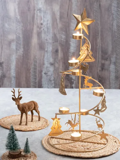 My brushed gold spiral Christmas tree stand is a showstopper. It holds multiple tea light candles and is adorned with little reindeer and tree charms.