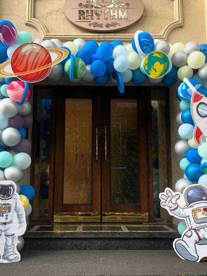 The space adventure started at the entrance with a galactic balloon arch decorated with planets and astronaut cutouts.