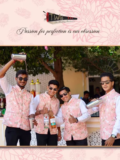 Our team having fun while they work, showcasing their synchronized pouring skills at a Haldi brunch in Ranthambore.