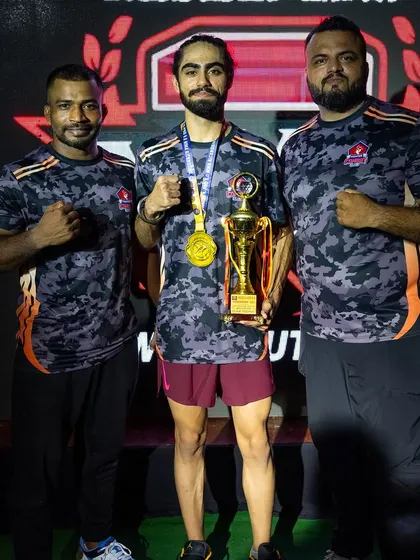 Sukjeet Singh, another one of our champions from the Hades MMA event, standing proud with his coaches.