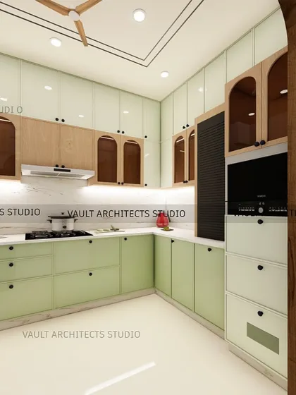 A glimpse into a modular kitchen I designed, featuring a fresh, two-tone color scheme with sage green and natural wood cabinets. The 3D render details the layout, including the built-in oven and chimney placement for a clean look.