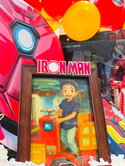 The special Ghibli-style artwork of the birthday boy, framed and incorporated into the hamper, adding a unique and artistic touch.